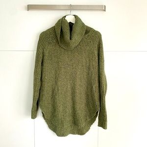 Green chunky cable-knit sweater